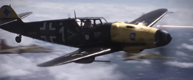 Aerial combat still of a German Messerschmitt fighter with yellow nose and black number 1 firing tracers above clouds