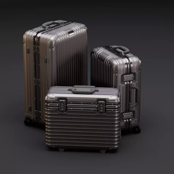 3D product render of three ribbed aluminium suitcases, two upright and one flat case, lit against a dark backdrop