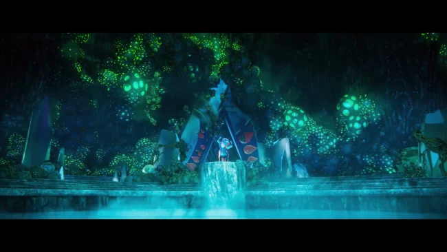 Animated film still of a glowing turquoise cavern with a small figure standing above a waterfall beneath luminous pods